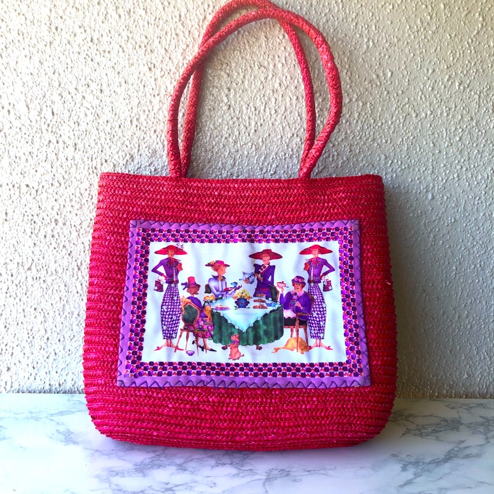 Red Hat Straw Handbag with lady’s gathered around  on the front!